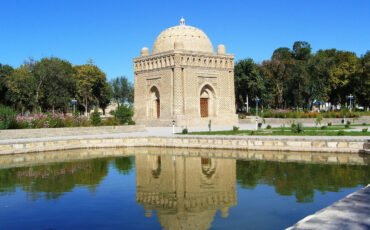 Samanide mausoleum in Bukhara mirrors in a pond