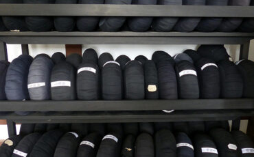 Black zazen cushions stacked on a shelf