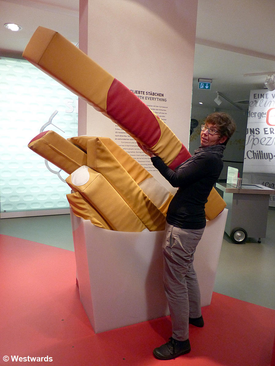 Natascha with giant pommes frittes at Berlin Currywurst museum