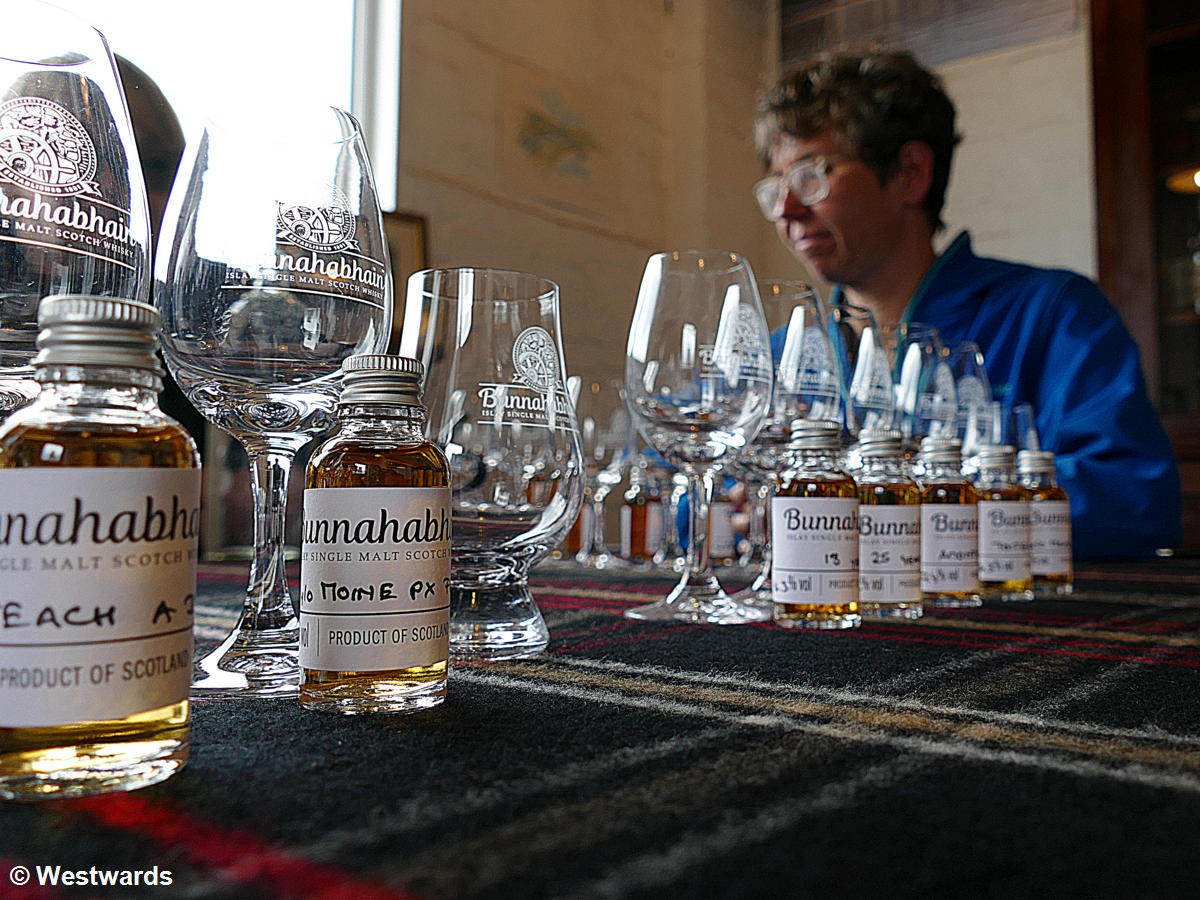 Travellers at a whisky tasting at Bunnahabhain distillery