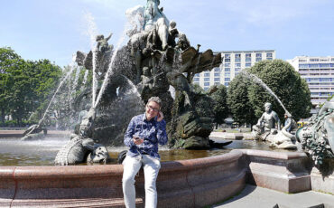 Woman in front of the Neptun fountain in Berlin