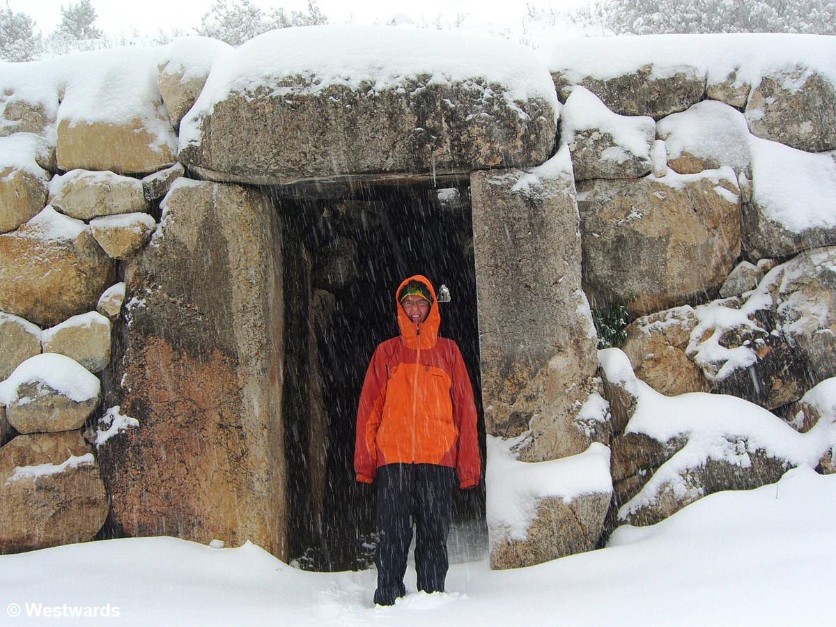 Natascha in raingear at the gate of the Sphinxes in Hattusha with much snow