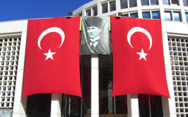 Turkish flags and huge portrait of Atatürk with Fes, in Ankara