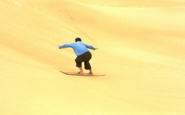 Isa sandboarding at the Siwa desert