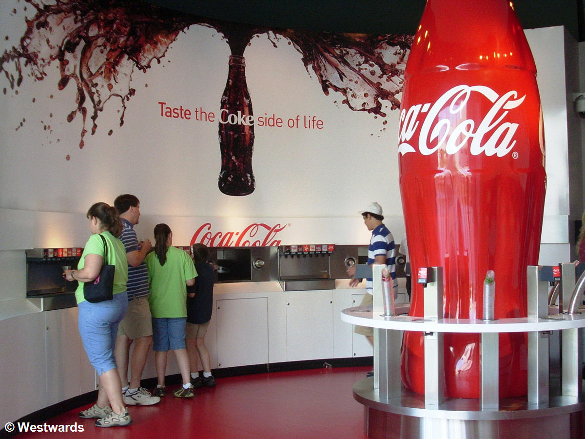 visitors in the tasting area of Coca Cola World in Atlanta