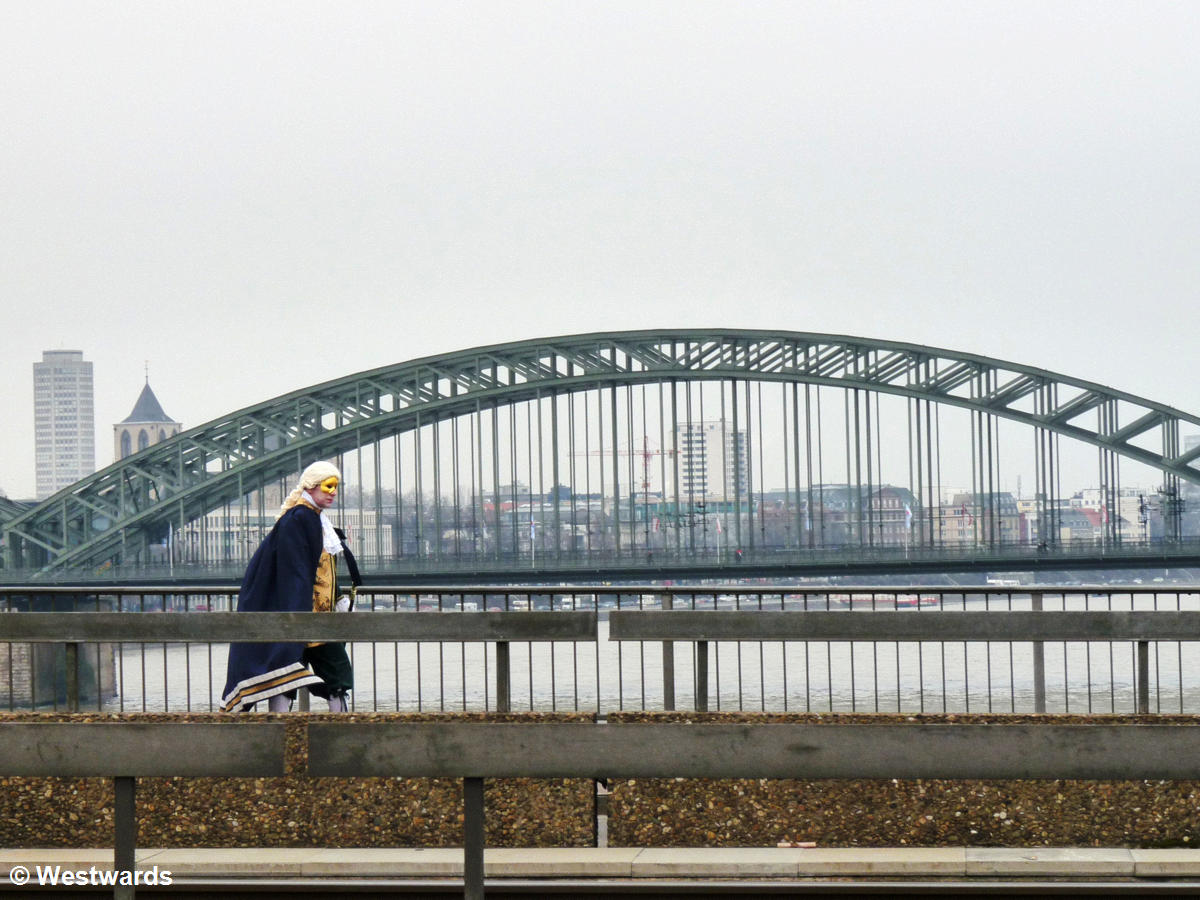 Man in baroque costume on a bridge in Cologne