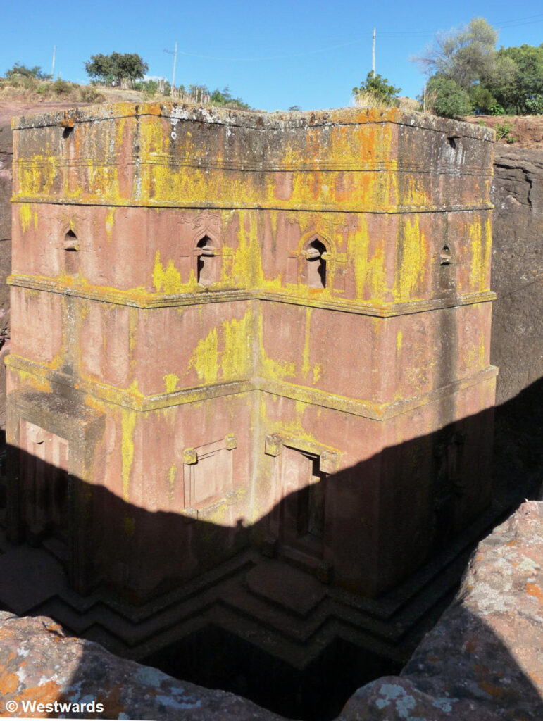 Priest in Bet Danaghel Church holding the Cross of King Lalibela. The  rock-hewn churches of Lalibela make it one of the greatest  Religio-Historical sites not only in Africa but in the Christian