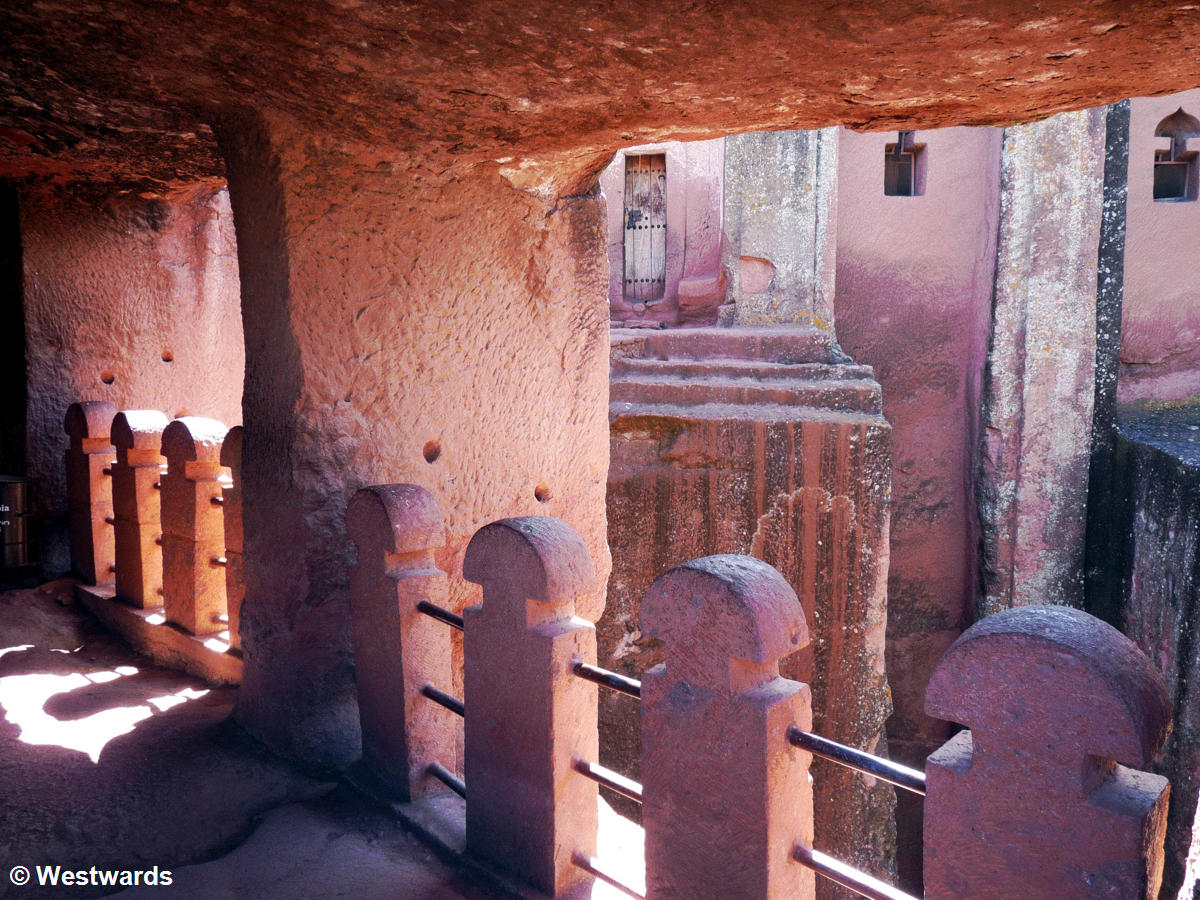 Priest in Bet Danaghel Church holding the Cross of King Lalibela. The  rock-hewn churches of Lalibela make it one of the greatest  Religio-Historical sites not only in Africa but in the Christian