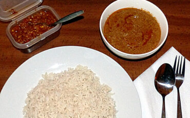 Plate of rice with chilli and soup