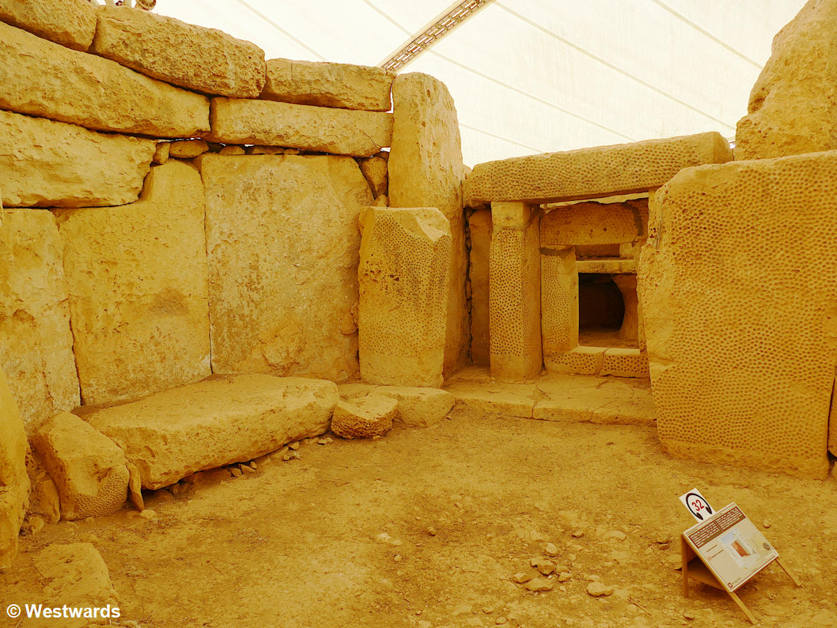 Decorated large stone walls in the Megalithic temple of Mnajdra in Malta