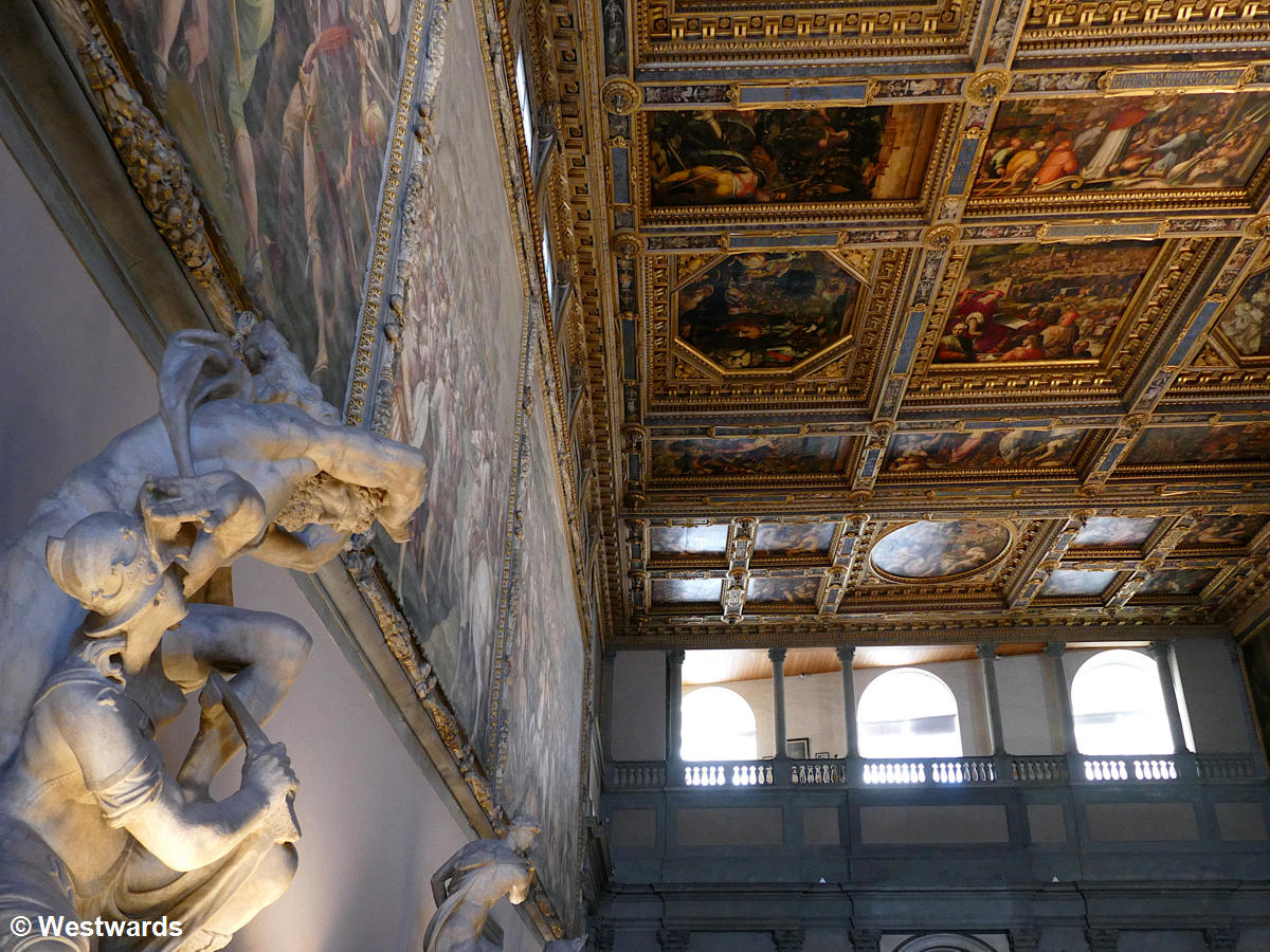 large paintings covering walls and ceiling of the Palazzo Vecchio