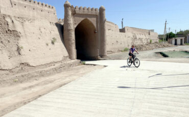 Cycling along Khiva's outer city wall