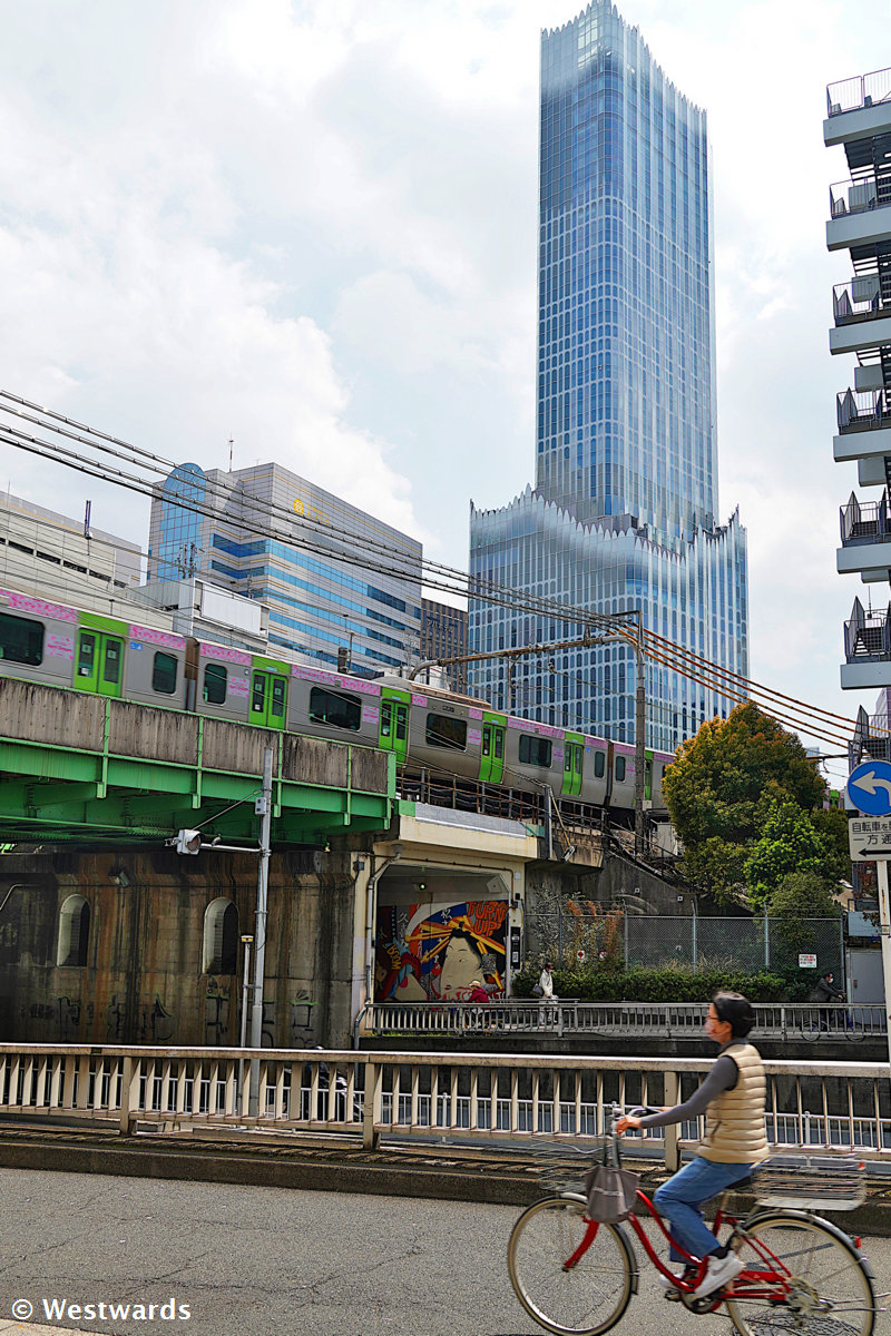 Kabukicho Tower with Yamanote Line train passing in front