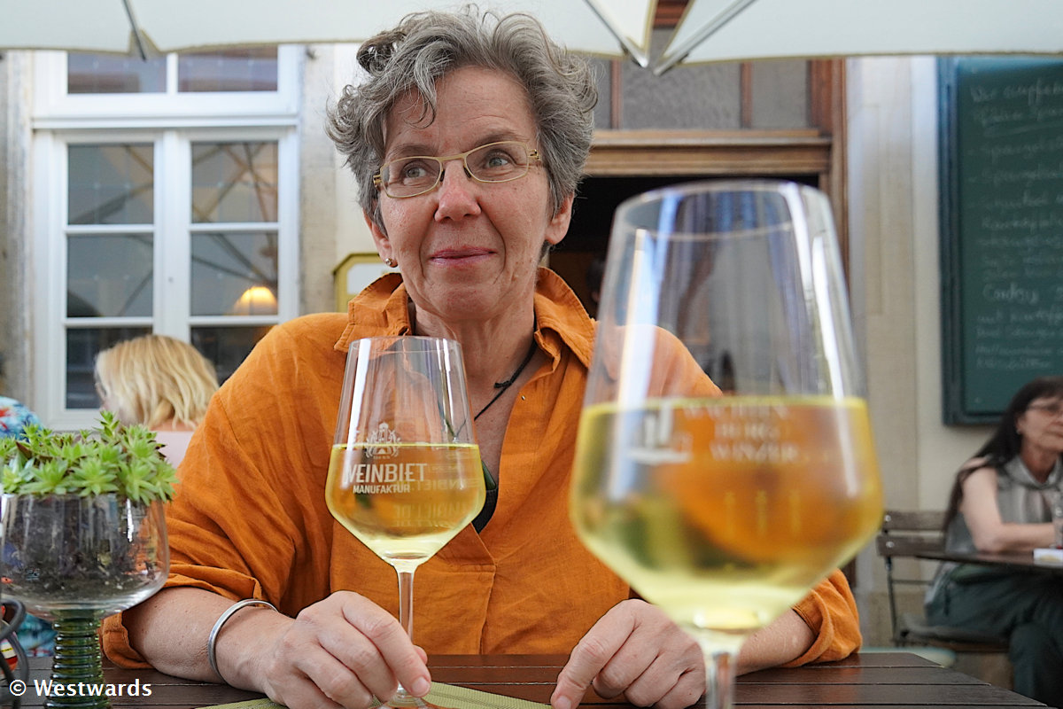 Travel blogger Natascha tasting a local wine at the Rabennest wine bar
